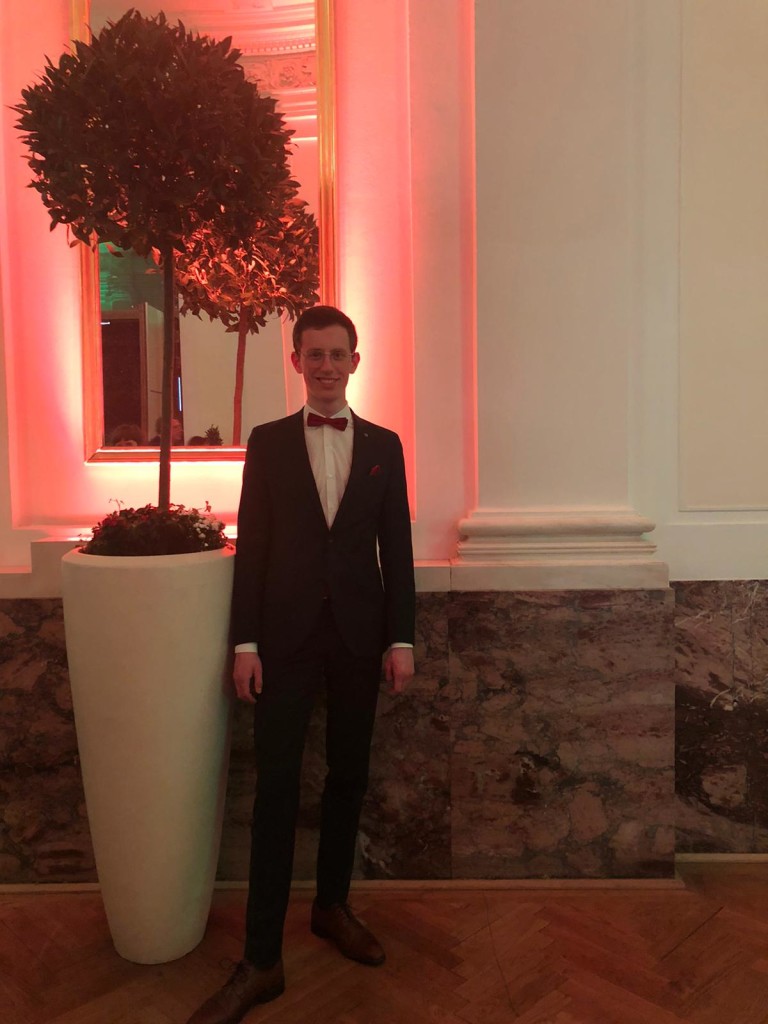Lorenz in a suit at a Viennese ball